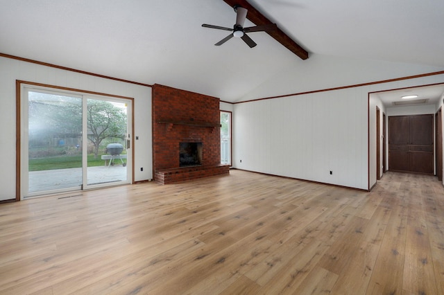 4542 S Holiday Ave, Springfield, MO 65810 - unfurnished living room with ceiling fan, light wood-style flooring, lofted ceiling with beams, and plenty of natural light