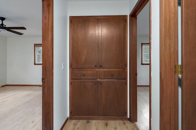 4542 S Holiday Ave, Springfield, MO 65810 - hallway featuring baseboards and light wood-style floors