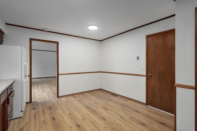 4542 S Holiday Ave, Springfield, MO 65810 - spare room with light wood-style floors and crown molding