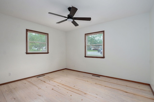 4542 S Holiday Ave, Springfield, MO 65810 - spare room with baseboards, light wood-style floors, and visible vents