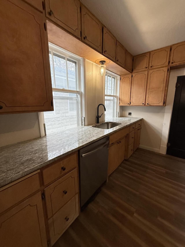 1001 E Pacific St, Springfield, MO 65803 - kitchen with dark wood finished floors, stainless steel dishwasher, a sink, and baseboards