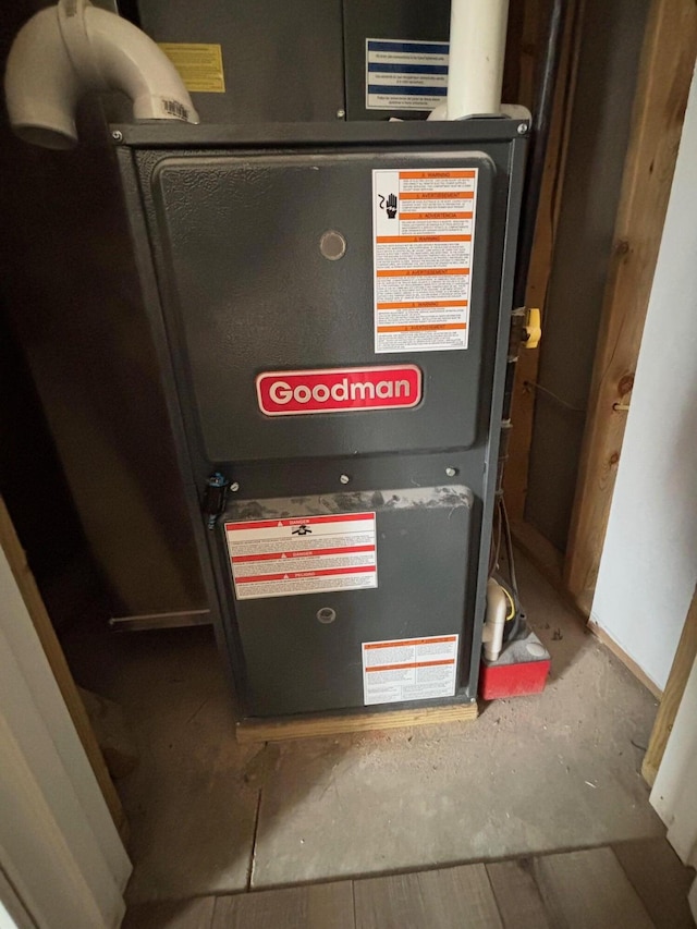 utility room featuring heating unit