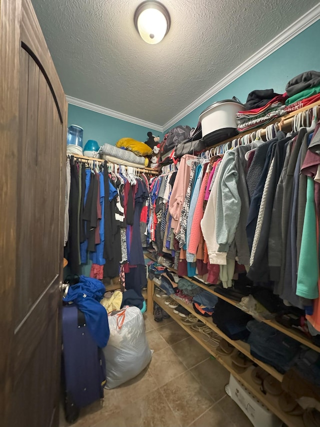 walk in closet featuring tile patterned flooring