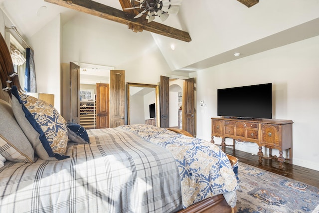 845 W Farm Road 96, Springfield, MO 65803 - bedroom with wood finished floors, a ceiling fan, beamed ceiling, baseboards, and high vaulted ceiling