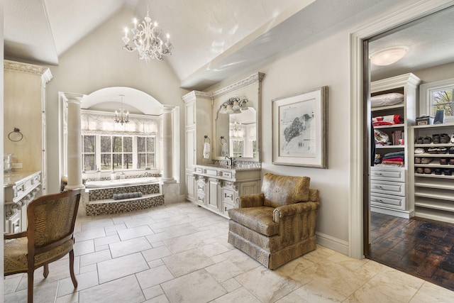 845 W Farm Road 96, Springfield, MO 65803 - sitting room featuring baseboards, lofted ceiling, a notable chandelier, and ornate columns