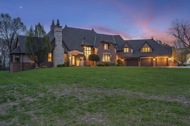 845 W Farm Road 96, Springfield, MO 65803 - french country inspired facade featuring stone siding, a chimney, and a yard
