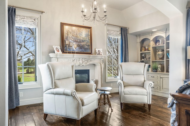 845 W Farm Road 96, Springfield, MO 65803 - sitting room with hardwood / wood-style floors, a high end fireplace, an inviting chandelier, baseboards, and visible vents