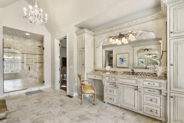 845 W Farm Road 96, Springfield, MO 65803 - bathroom with baseboards, vanity, a stall shower, and an inviting chandelier