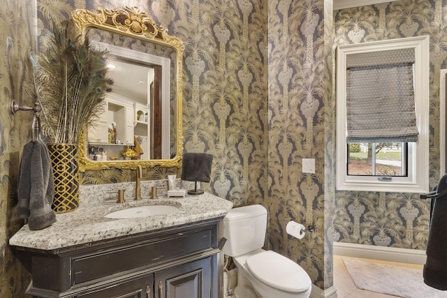 845 W Farm Road 96, Springfield, MO 65803 - bathroom with wallpapered walls, baseboards, vanity, and toilet