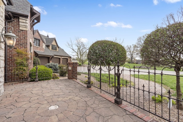 845 W Farm Road 96, Springfield, MO 65803 - view of patio / terrace with a gate, fence, and driveway