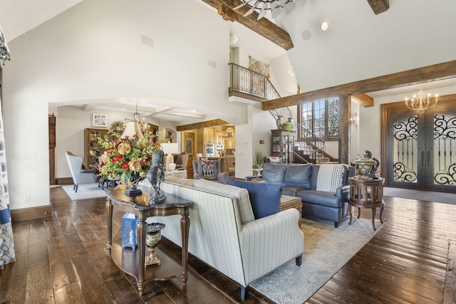 845 W Farm Road 96, Springfield, MO 65803 - living area with french doors, a notable chandelier, stairway, high vaulted ceiling, and wood-type flooring