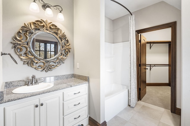 845 W Farm Road 96, Springfield, MO 65803 - bathroom featuring shower / bath combination, tile patterned flooring, vanity, and a walk in closet