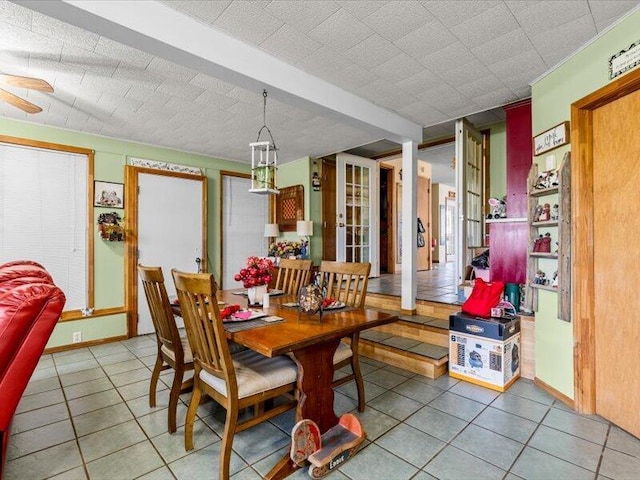 dining area with ceiling fan and light tile patterned floors