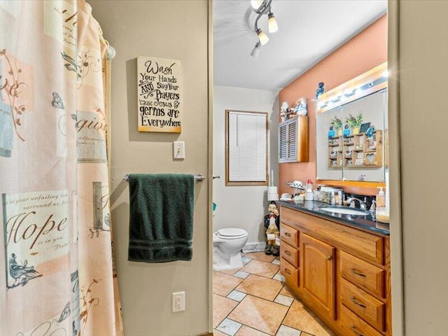 bathroom with toilet and vanity