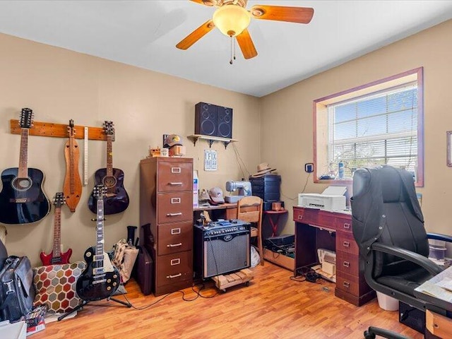 office space featuring ceiling fan and light wood-style flooring