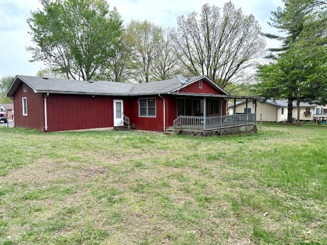 700 Ridgeway, Mountain View, MO 65548 - back of house featuring a wooden deck and a lawn
