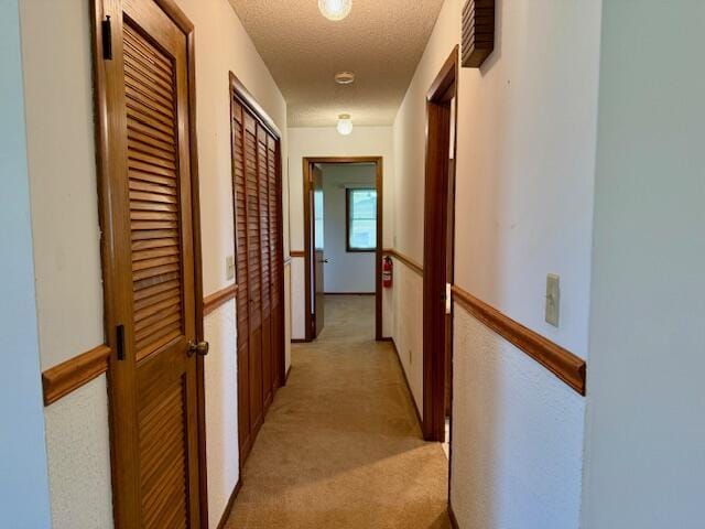 700 Ridgeway, Mountain View, MO 65548 - hall featuring a textured ceiling, light carpet, and an upstairs landing
