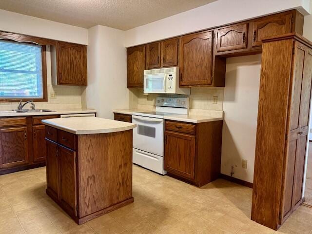 700 Ridgeway, Mountain View, MO 65548 - kitchen with decorative backsplash, a sink, white appliances, and light countertops