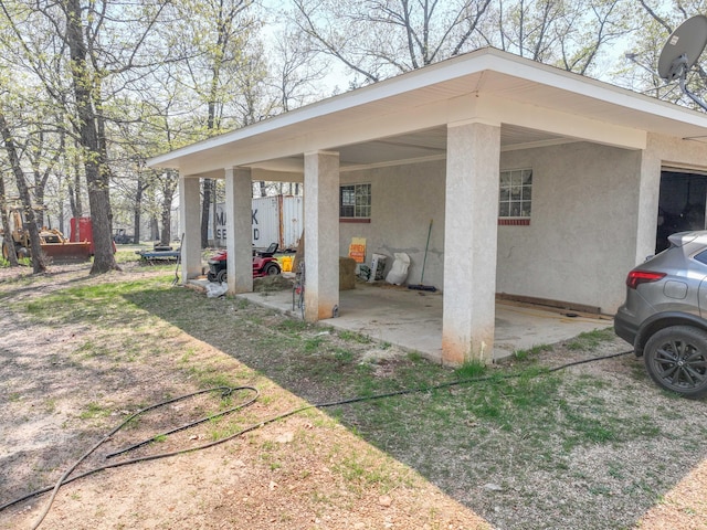 exterior space with a carport