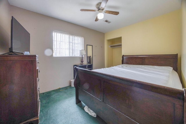 carpeted bedroom with visible vents and a ceiling fan
