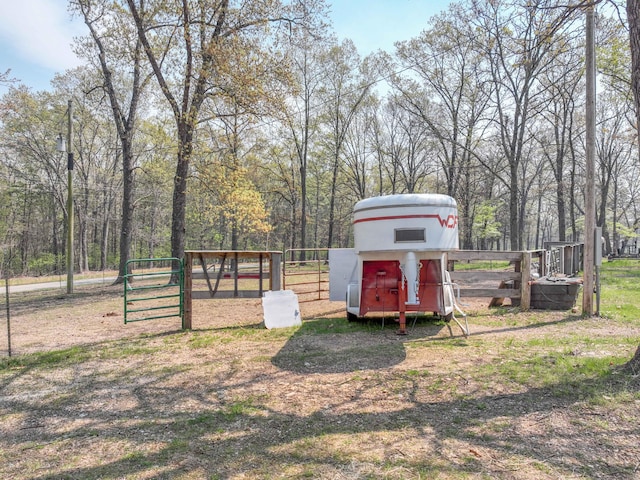 view of outbuilding featuring fence