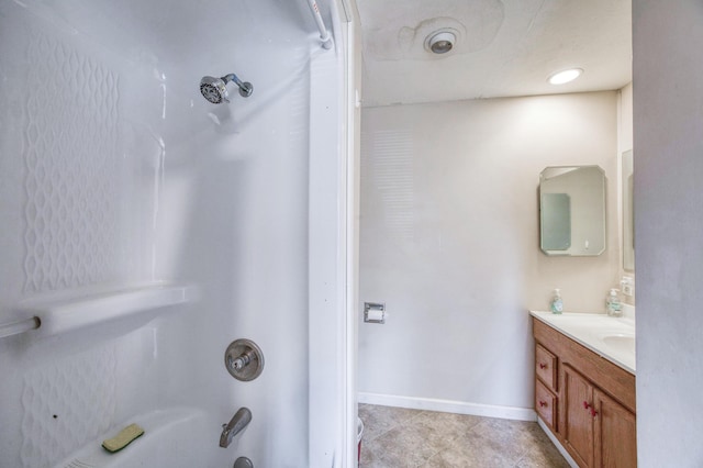 full bathroom with shower / bath combination, baseboards, vanity, and tile patterned floors
