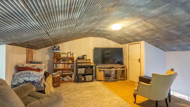 living area featuring vaulted ceiling