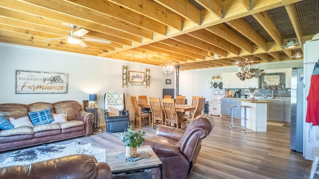 living room featuring a ceiling fan and wood finished floors