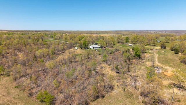 bird's eye view featuring a wooded view