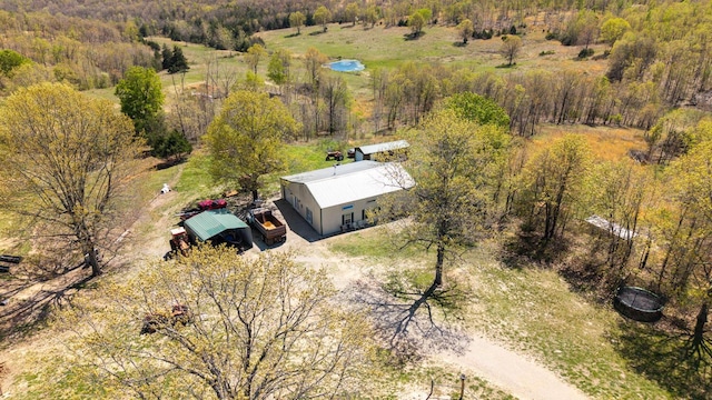 bird's eye view featuring a forest view