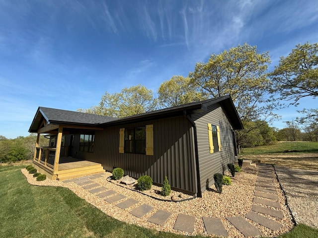 exterior space with a lawn and covered porch