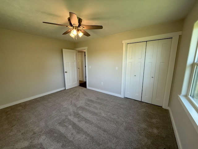unfurnished bedroom featuring baseboards, carpet, a closet, and ceiling fan