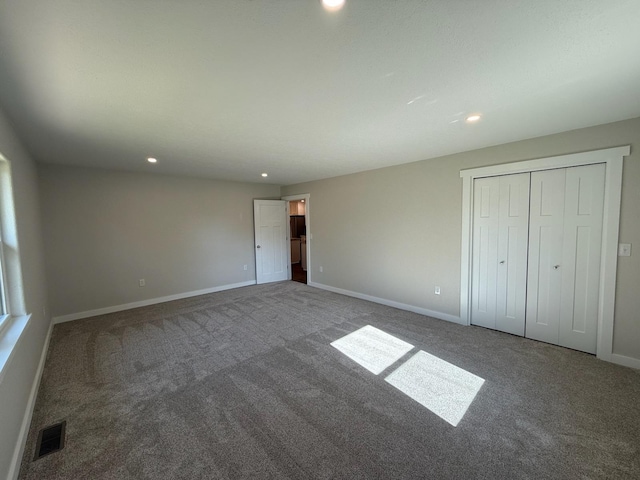 unfurnished bedroom featuring carpet floors, visible vents, and recessed lighting