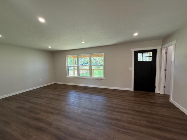 entryway featuring dark wood finished floors, baseboards, a healthy amount of sunlight, and recessed lighting