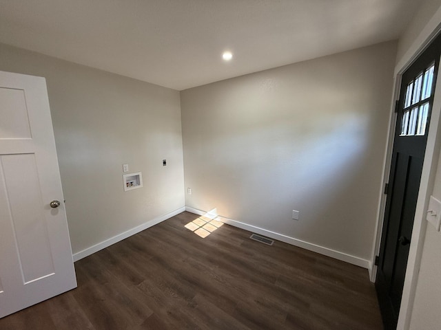 clothes washing area with hookup for an electric dryer, baseboards, dark wood-type flooring, visible vents, and washer hookup