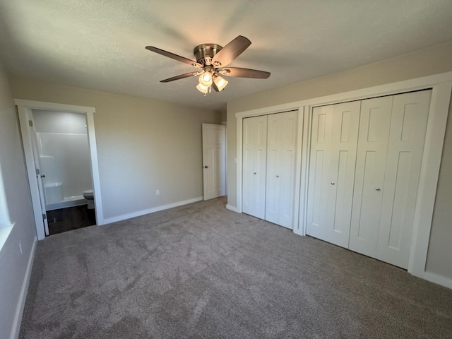 unfurnished bedroom featuring connected bathroom, two closets, ceiling fan, carpet, and baseboards