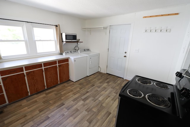 419 E Olive St, Bolivar, MO 65613 - washroom with wood finished floors, washing machine and clothes dryer, and laundry area