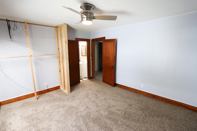 419 E Olive St, Bolivar, MO 65613 - unfurnished bedroom with carpet, baseboards, and ceiling fan