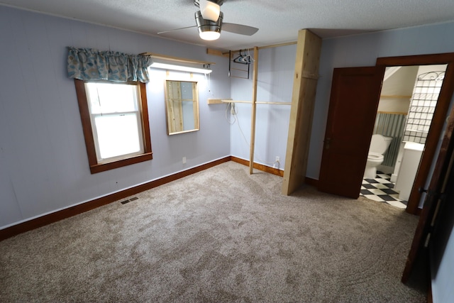 419 E Olive St, Bolivar, MO 65613 - unfurnished bedroom featuring a textured ceiling, ceiling fan, carpet, baseboards, and visible vents