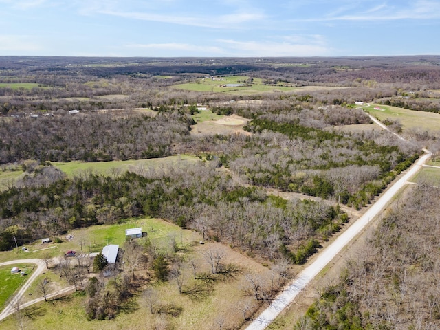118 Bethel Rd, Long Lane, MO 65590 - aerial view featuring a wooded view