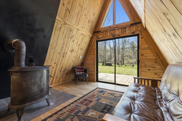 118 Bethel Rd, Long Lane, MO 65590 - living area with wood-type flooring, wood walls, and vaulted ceiling