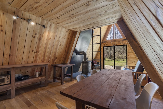 118 Bethel Rd, Long Lane, MO 65590 - dining area with wooden ceiling, hardwood / wood-style flooring, wood walls, and a wood stove