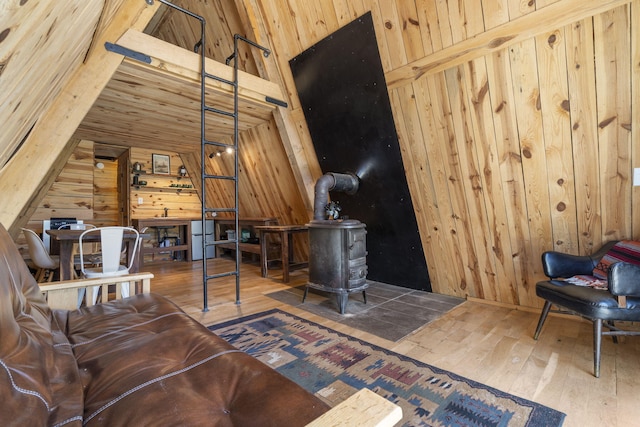 118 Bethel Rd, Long Lane, MO 65590 - sitting room featuring wooden walls, hardwood / wood-style floors, and a wood stove