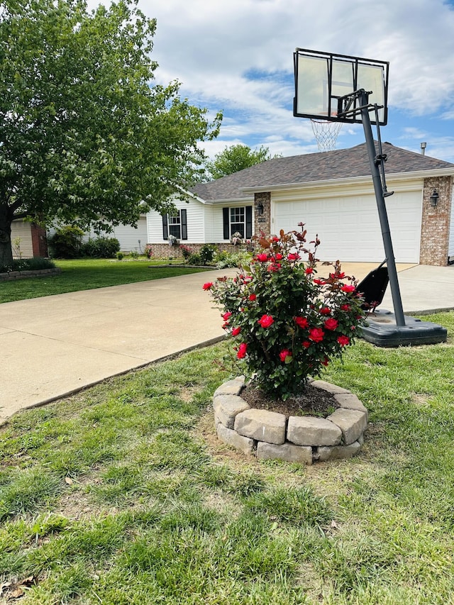 4723 W Portland St, Springfield, MO 65802 - view of front of house with concrete driveway, brick siding, an attached garage, and a front lawn