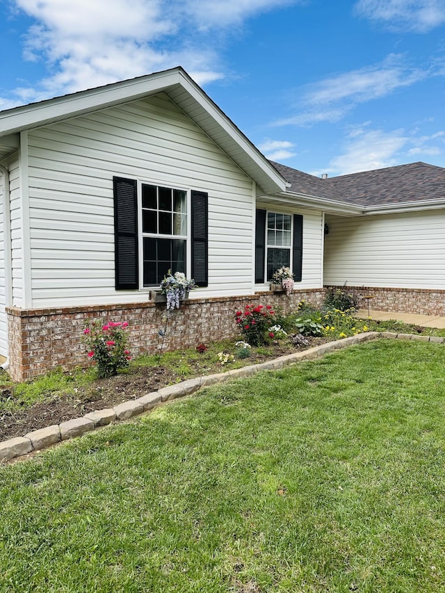 4723 W Portland St, Springfield, MO 65802 - view of front of property with brick siding, a front lawn, and a shingled roof