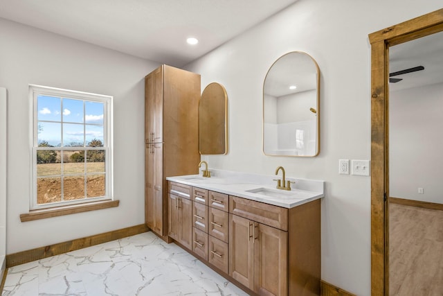 10560 State Highway U, Rogersville, MO 65742 - bathroom with double vanity, ceiling fan, marble finish flooring, baseboards, and recessed lighting
