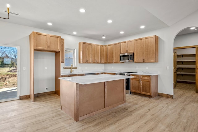 10560 State Highway U, Rogersville, MO 65742 - kitchen featuring appliances with stainless steel finishes, a center island, light wood-style flooring, light countertops, and recessed lighting