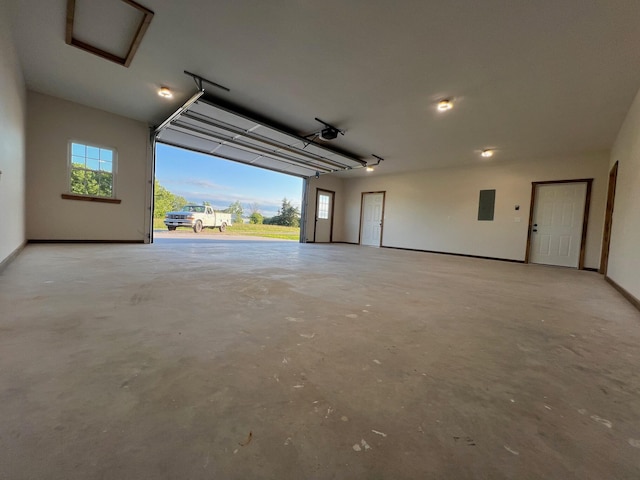 10560 State Highway U, Rogersville, MO 65742 - garage featuring electric panel, a garage door opener, and baseboards