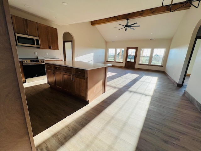 10560 State Highway U, Rogersville, MO 65742 - kitchen featuring arched walkways, appliances with stainless steel finishes, dark wood-type flooring, and light countertops