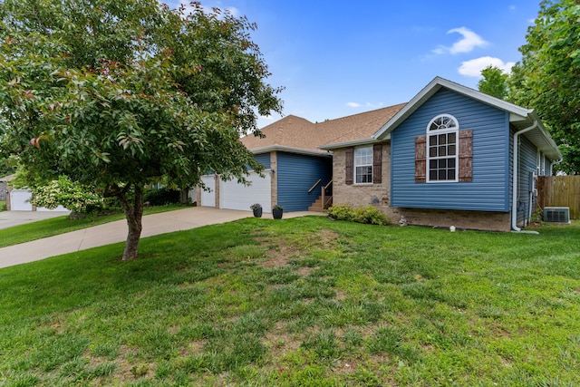 700 W Snider St, Ozark, MO 65721 - single story home with concrete driveway, an attached garage, central AC unit, and brick siding